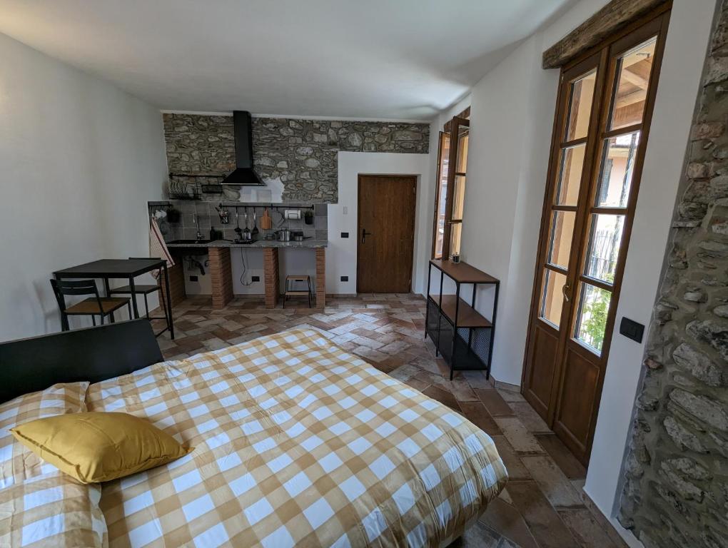 Postel nebo postele na pokoji v ubytování Antica Osteria Apartments