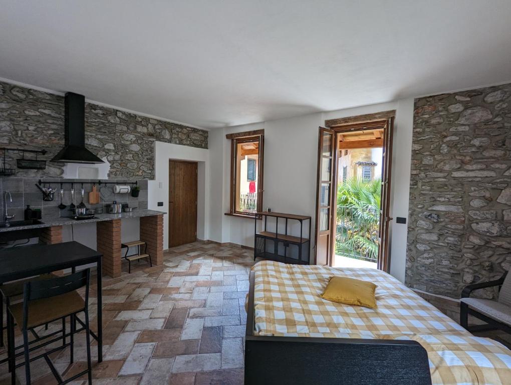 Postel nebo postele na pokoji v ubytování Antica Osteria Apartments