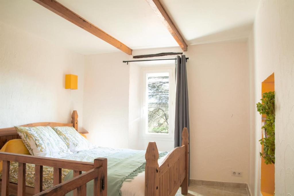 Una cama o camas en una habitaci&oacute;n de La Pigoussette