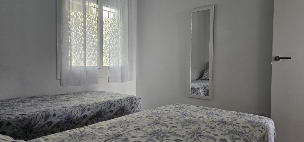 Postel nebo postele na pokoji v ubytování Apartamento Canyelles playa