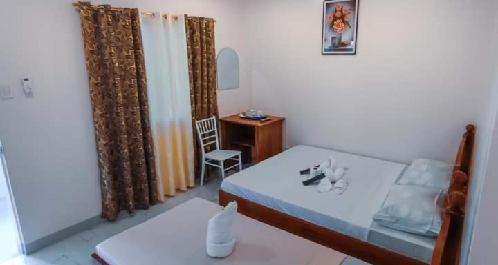 Postel nebo postele na pokoji v ubytování Elnora Delmar Travellers Inn