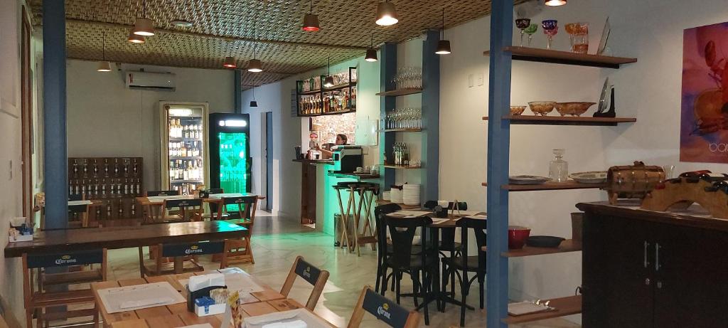 a restaurant with tables and chairs in a room at Hostel Leblon in Rio de Janeiro
