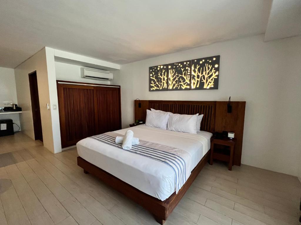 Postel nebo postele na pokoji v ubytování Aira Boracay Hotel