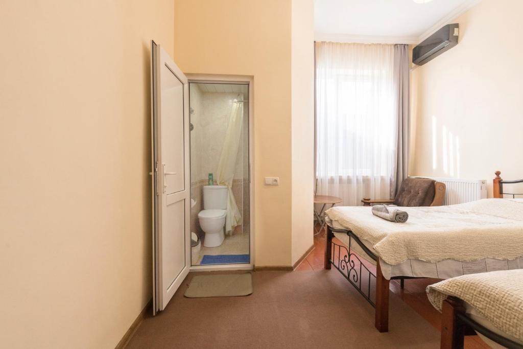 Postel nebo postele na pokoji v ubytování Tamari Guest House