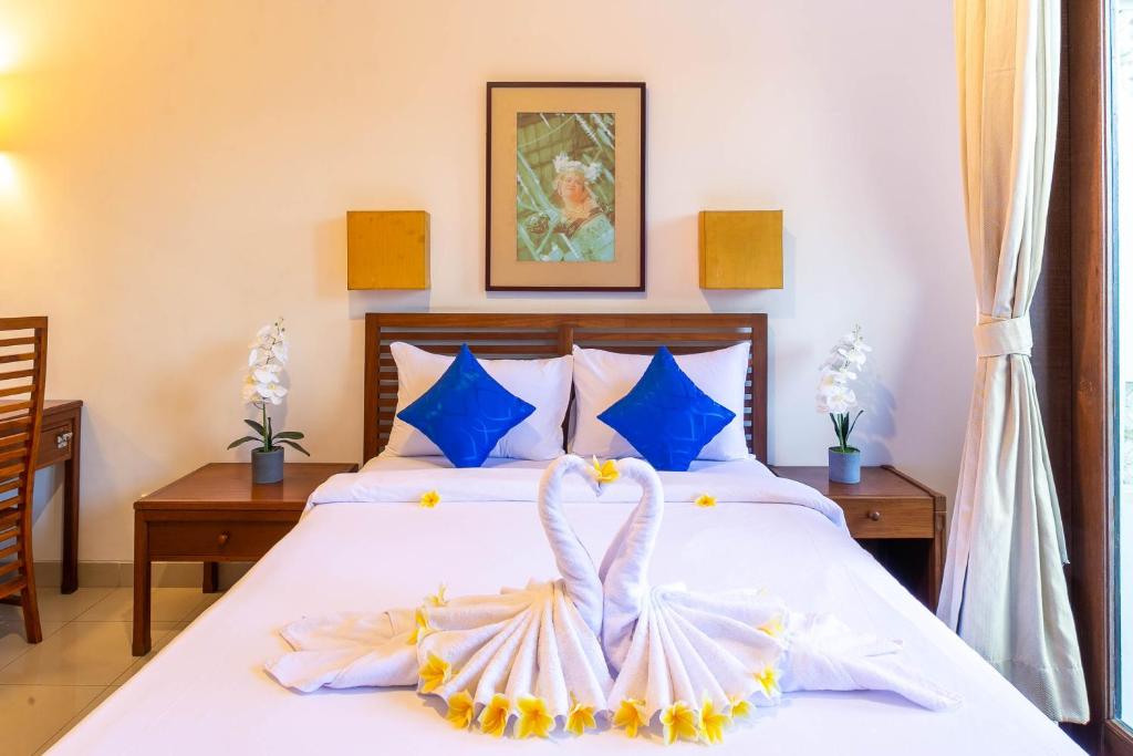 Postel nebo postele na pokoji v ubytování Starloka Saba Bali Hotel