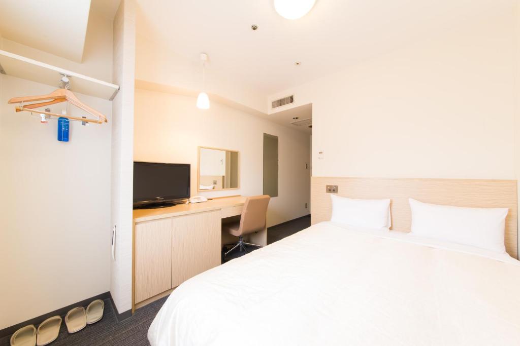 Postel nebo postele na pokoji v ubytování Hotel il Grande Umeda