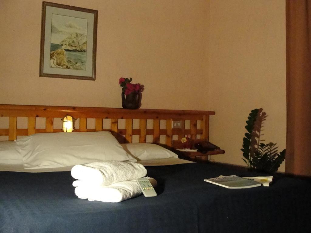 Postel nebo postele na pokoji v ubytování Hotel Scintilla