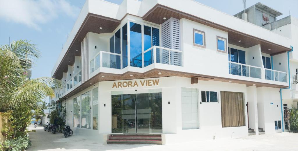 a large white building with a akoya view at Arora View in Maafushi