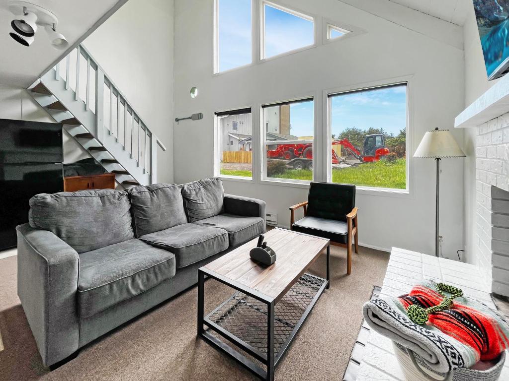 a living room with a couch and a table at Tidal House 2 in Ocean Shores