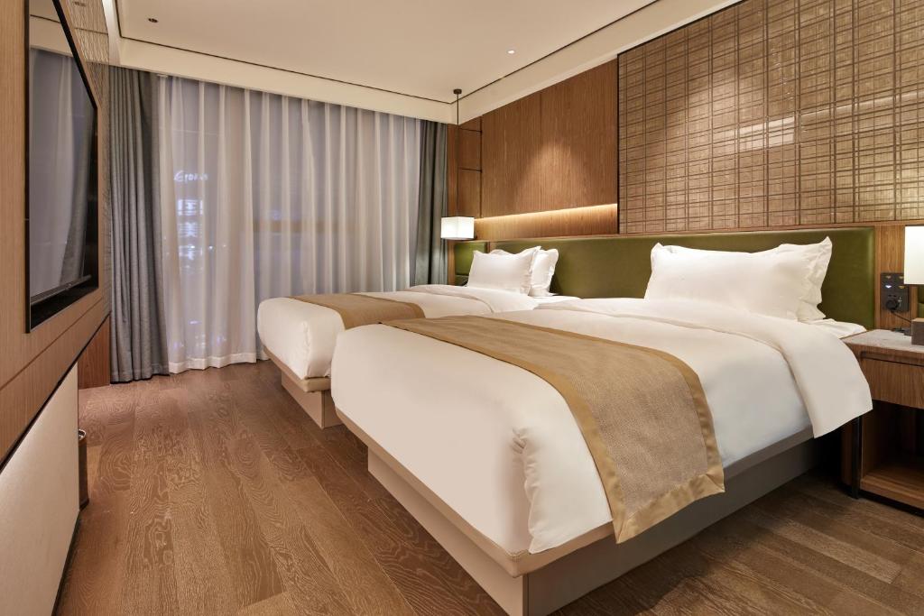 Fotografie z fotogalerie ubytování Dongguan Tangxia Huaman Hotel v destinaci Tung-kuan