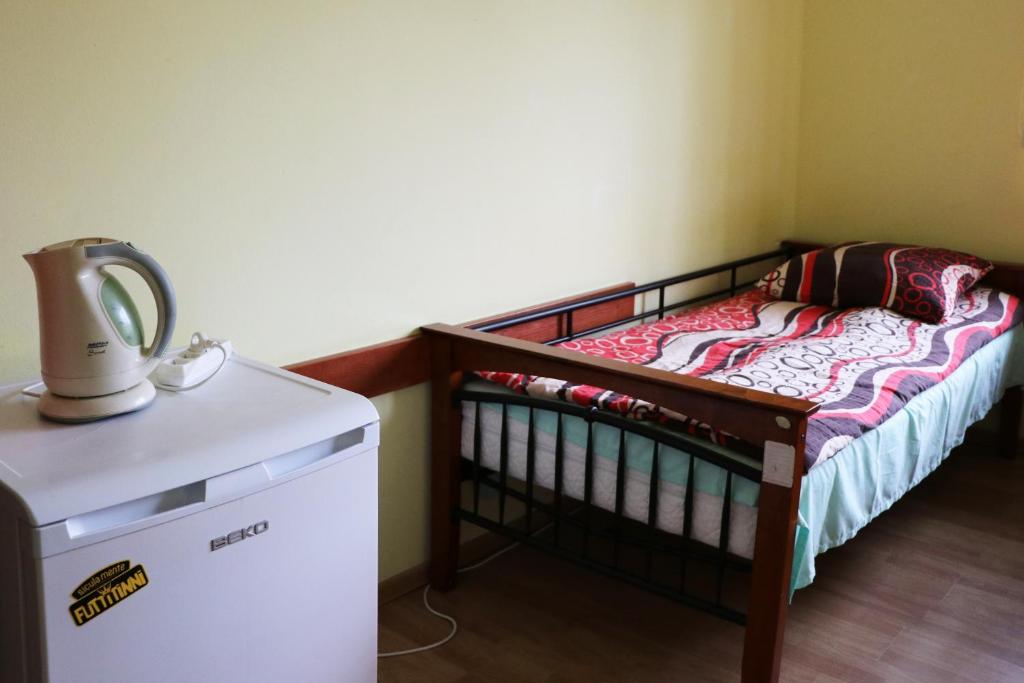 Letto o letti in una camera di Dom Studenta PANS - Akademik, Hostel