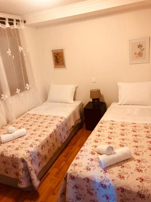 Un pat sau paturi într-o cameră la Olia Garden