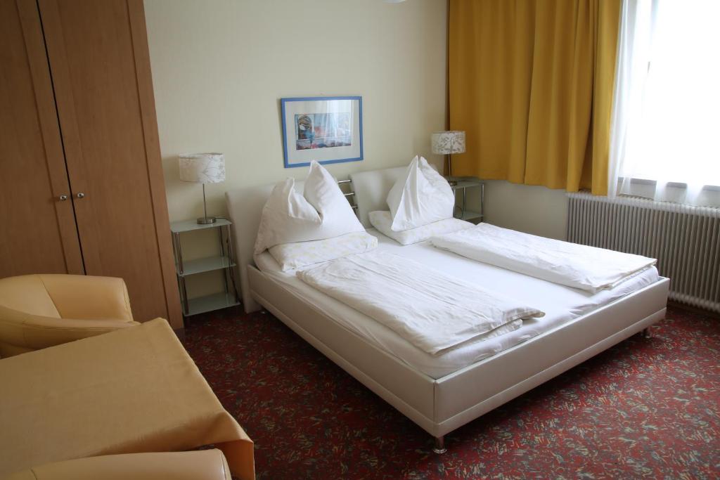 Postel nebo postele na pokoji v ubytování Hotel Reinisch