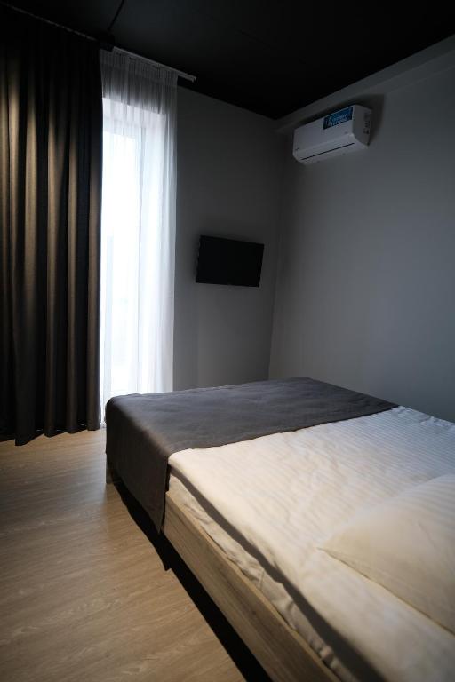 Postel nebo postele na pokoji v ubytování Vip Avtim hotel