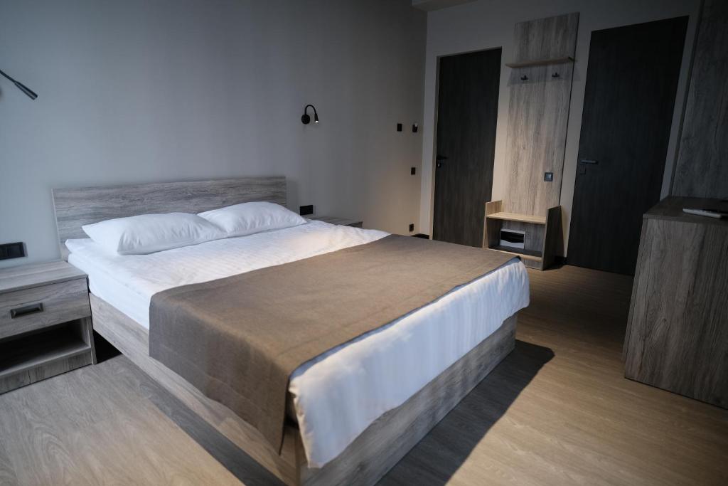 Postel nebo postele na pokoji v ubytování Vip Avtim hotel