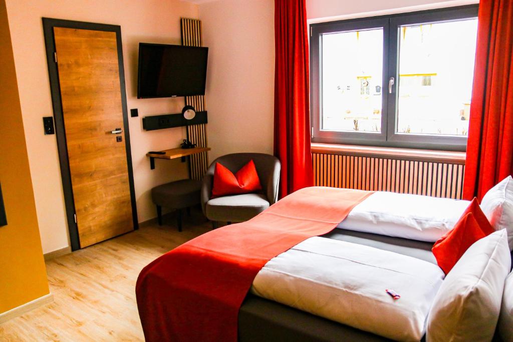 Postel nebo postele na pokoji v ubytování DAS PALMBERGER