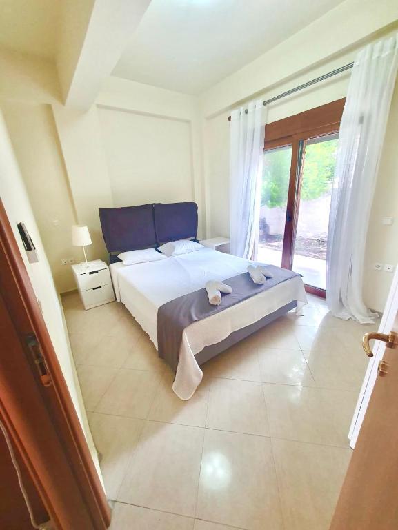 Postel nebo postele na pokoji v ubytování Seaside Getaway Kriopigi