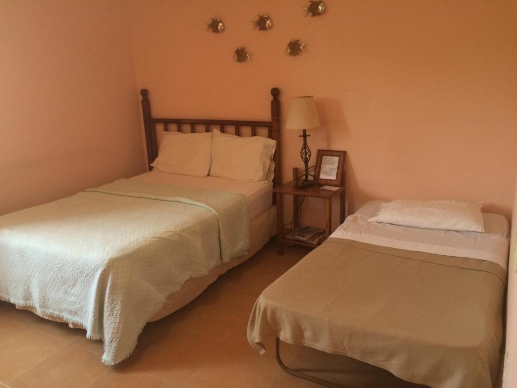 Voodi või voodid majutusasutuse Hostal Doña Maria toas