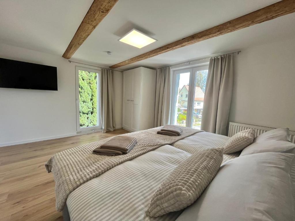 Postel nebo postele na pokoji v ubytování Ferienhaus „Am Sandstein“