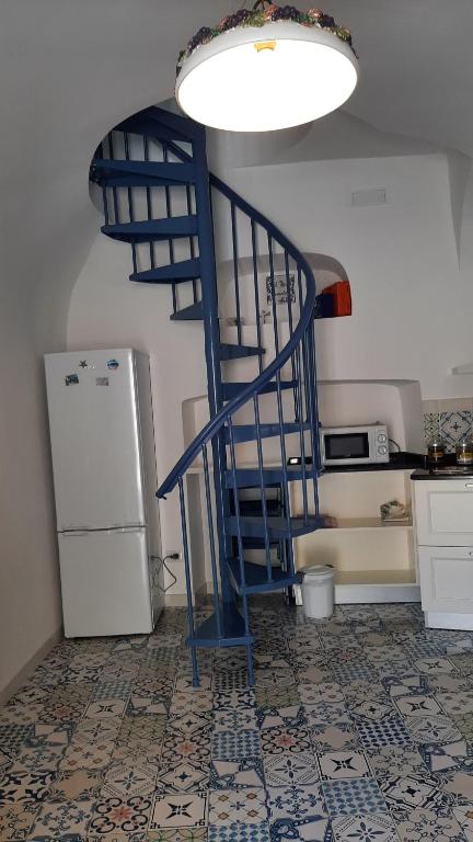 A kitchen or kitchenette at Petit Maison Jeranto
