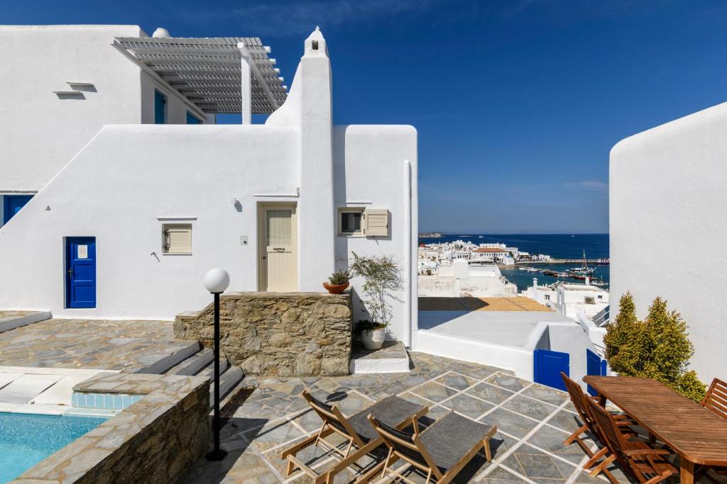 a view of a villa with a swimming pool at Supreme Mykonos Town House with Views & Pool & Parking in Mýkonos City