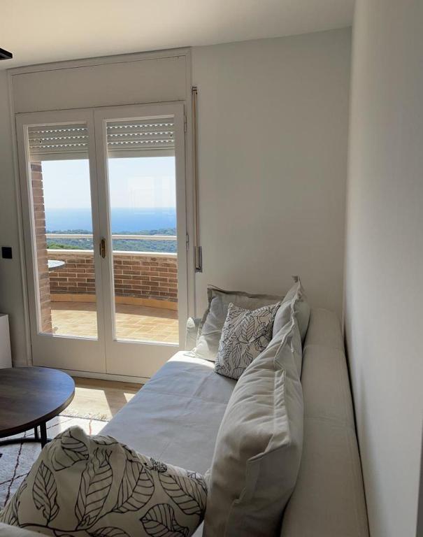 Posedenie v ubytovaní Apartamento entre mar y montaña