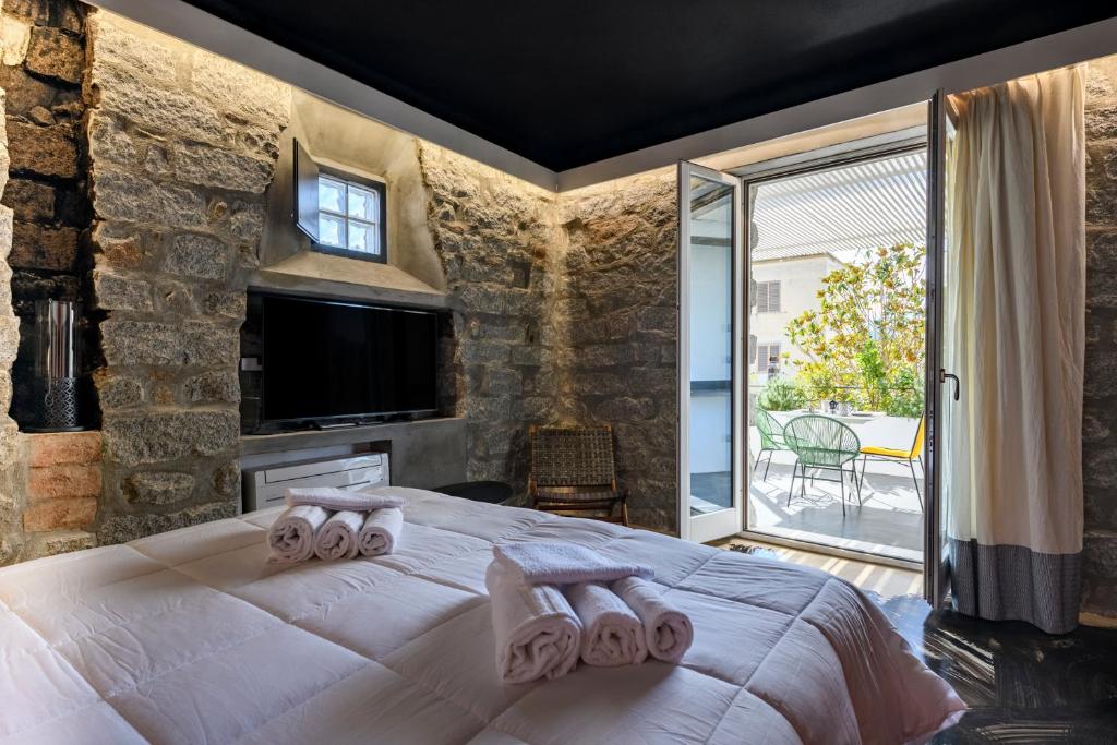Loft romantico con veranda tesisinde bir odada yatak veya yataklar