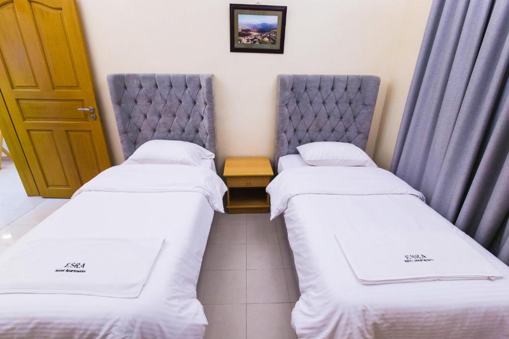 Postel nebo postele na pokoji v ubytování Esra Hotel Apartment