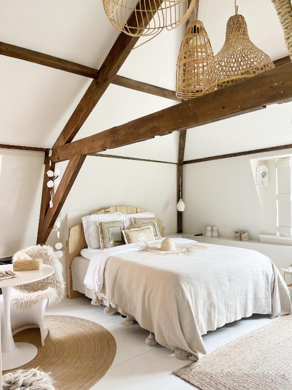 Ein Bett oder Betten in einem Zimmer der Unterkunft Het sfeerhuis aan zee