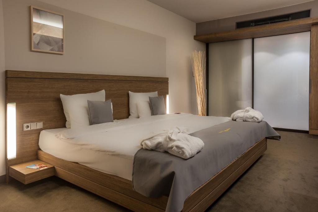 Postel nebo postele na pokoji v ubytování Hotel Stadtpalais