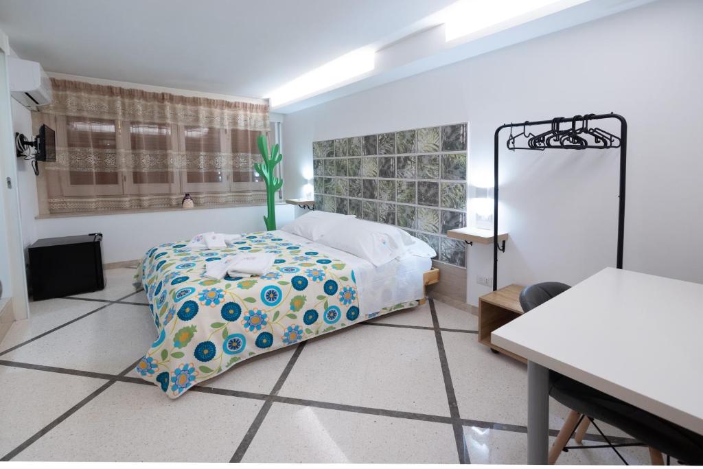 Postel nebo postele na pokoji v ubytování B&b Essence Ispica