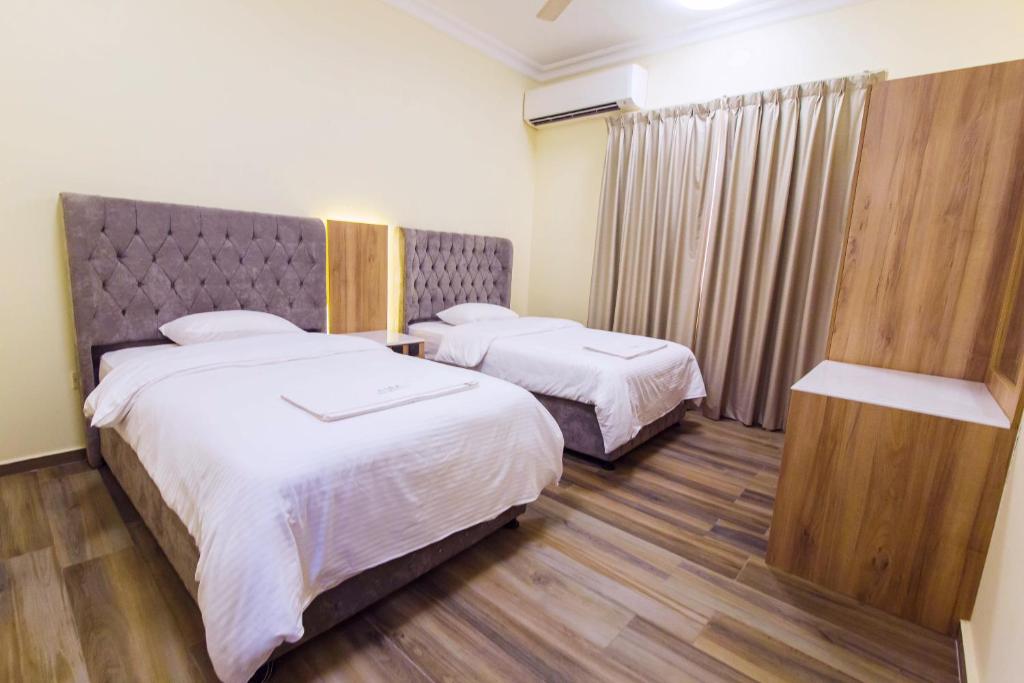 Postel nebo postele na pokoji v ubytování Esra Hotel Apartment