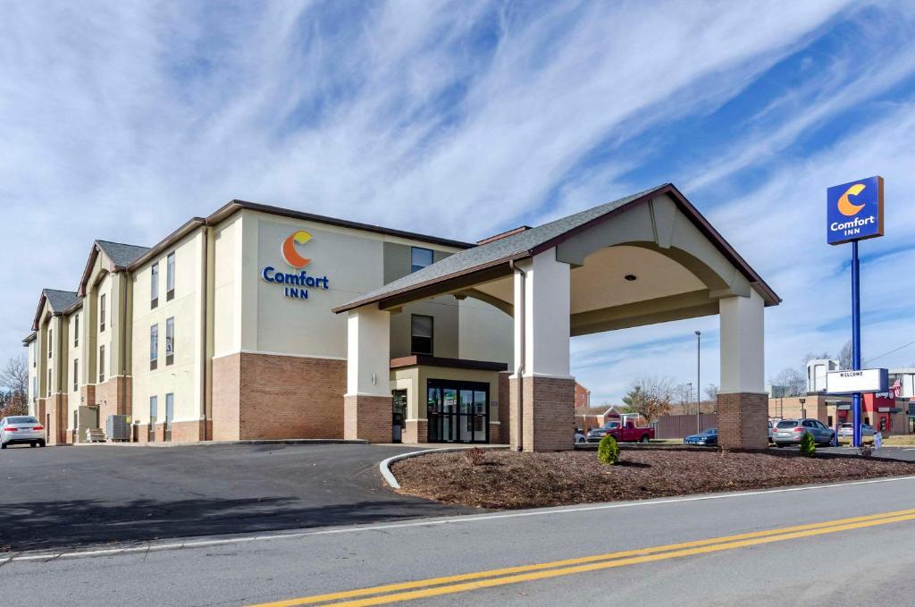 a rendering of a commercial building with a car dealership at Comfort Inn in Beckley