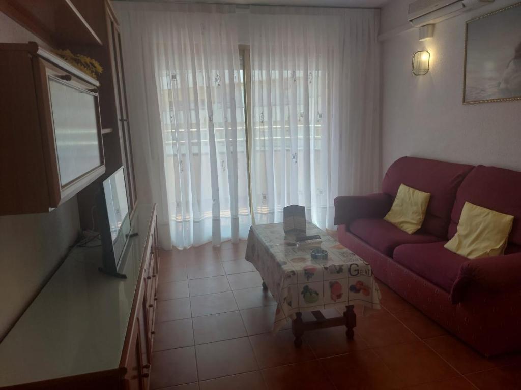 A television and/or entertainment centre at Rentalmar Cordoba - Sevilla - Jerez