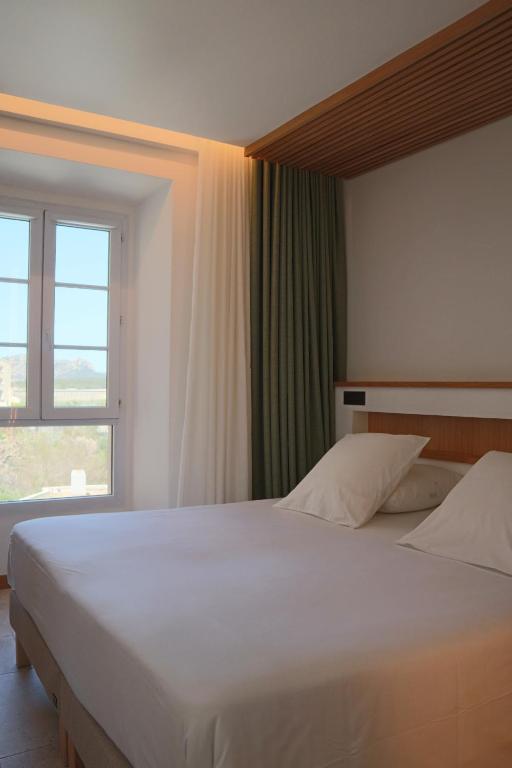 Postel nebo postele na pokoji v ubytování Le Royal Hôtel Restaurant