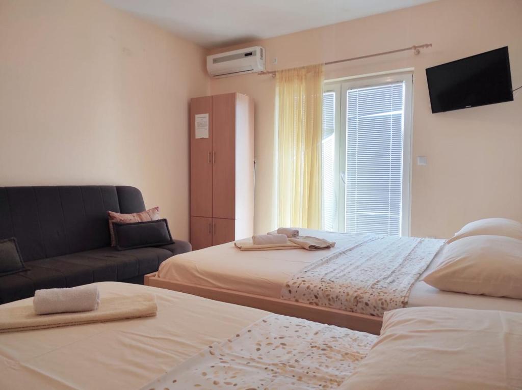 Postel nebo postele na pokoji v ubytování Apartments Draženka