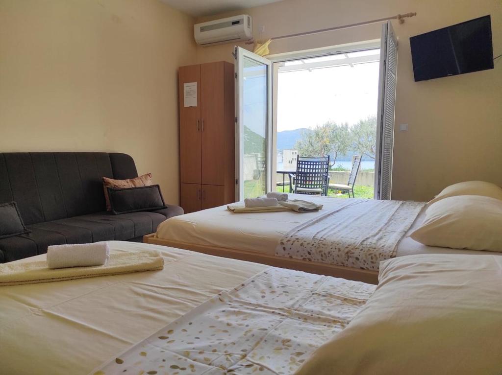 Postel nebo postele na pokoji v ubytování Apartments Draženka