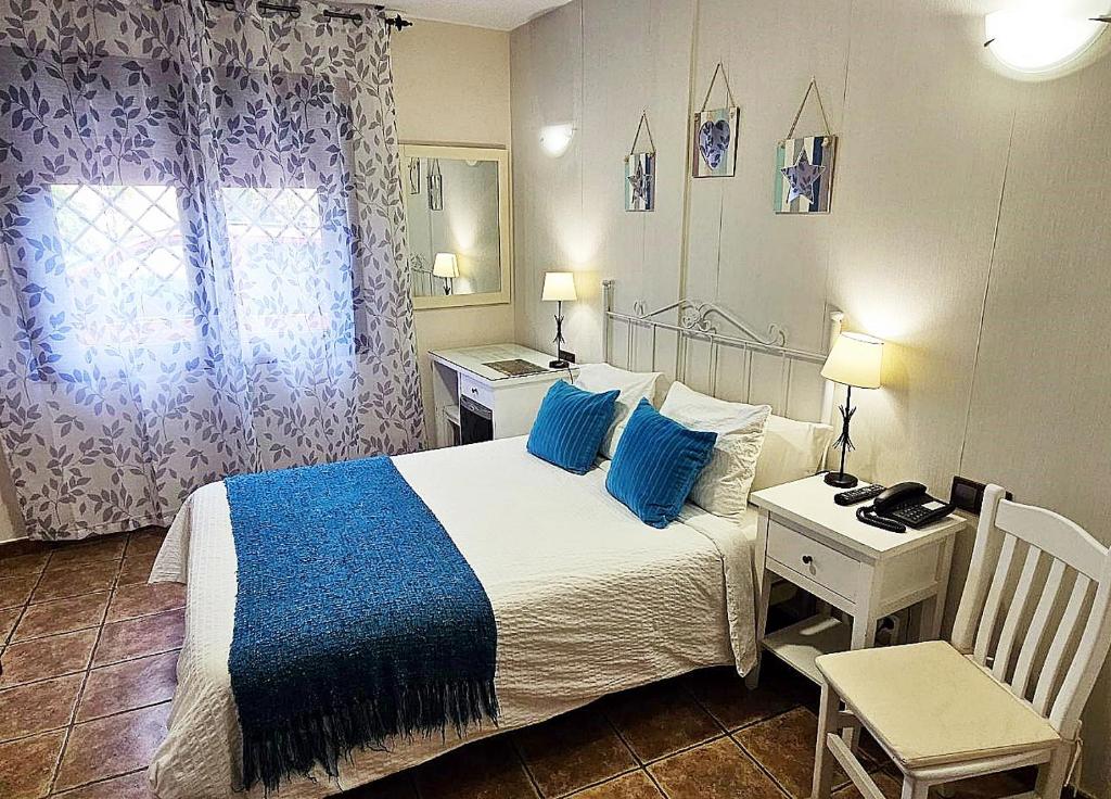 Postel nebo postele na pokoji v ubytování Hotel Medina de Toledo