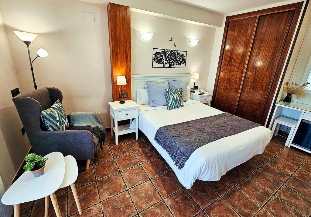 Postel nebo postele na pokoji v ubytování Hotel Medina de Toledo