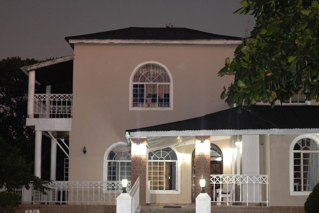 a house at night with lights at Captains Villa - where Lake Malawi and Shire River meet, historical hotel at waterfront next to the Lake Museum in Mangochi Town in Mponda