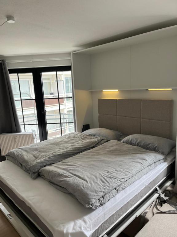 Postel nebo postele na pokoji v ubytování Haus Titania Wohnung Meerblick
