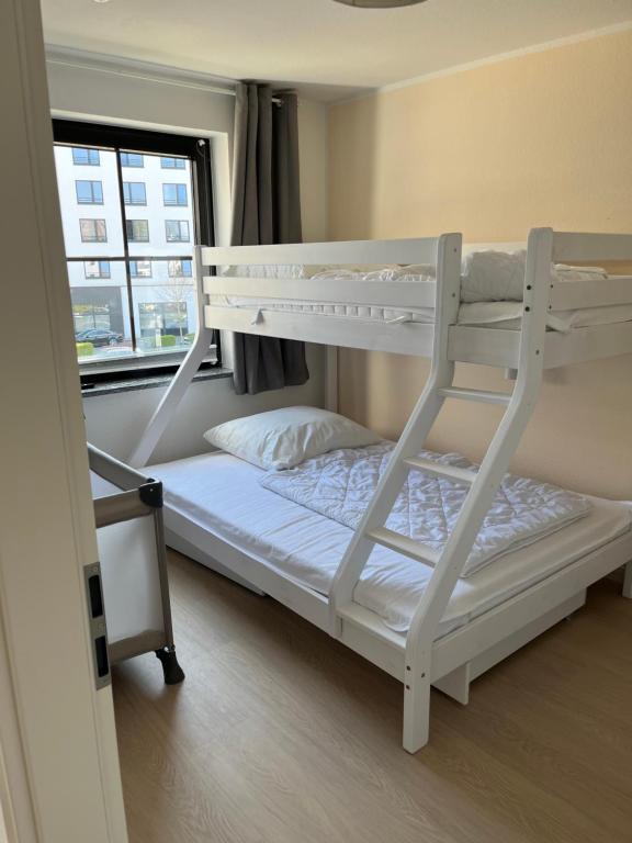 Postel nebo postele na pokoji v ubytování Haus Titania Wohnung Meerblick