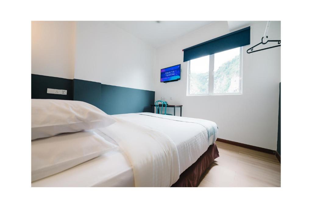 Postel nebo postele na pokoji v ubytování The Concept Hotel KL - Batu Caves