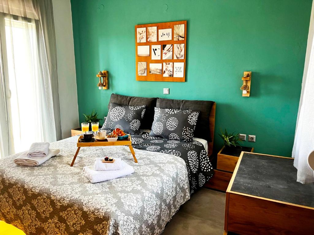 a bedroom with a bed with a table on it at Villa Stemily in Skala Rachoniou