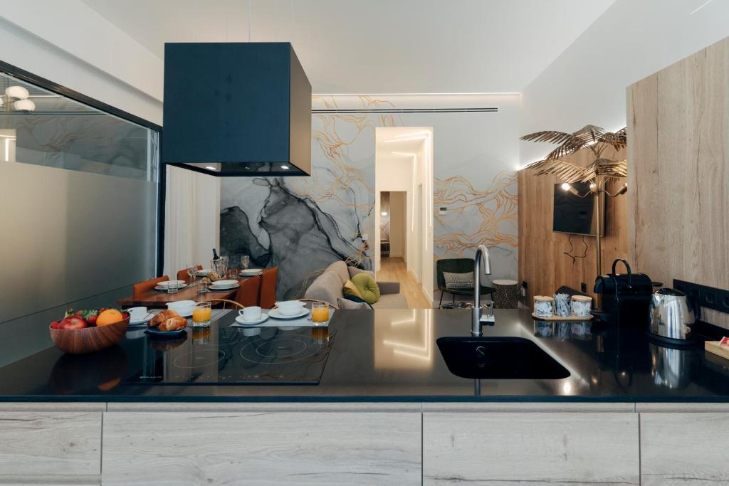 Kuchyň nebo kuchyňský kout v ubytování Galmen Suites