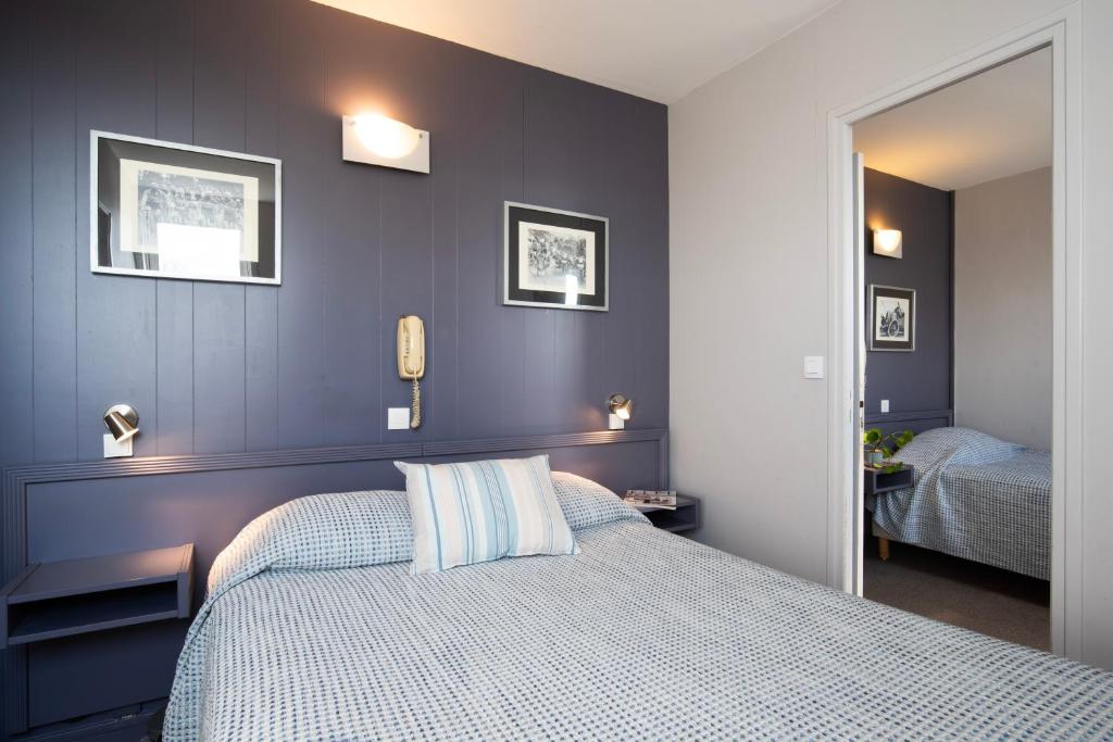 Postel nebo postele na pokoji v ubytování Hotel La Chope