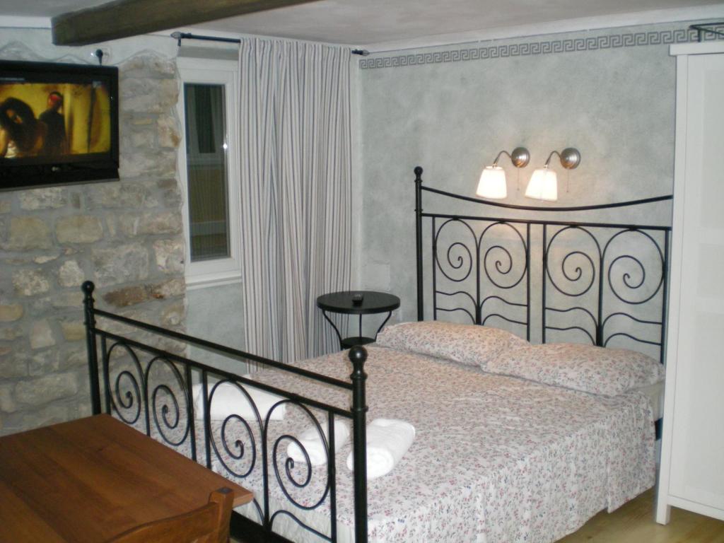 A bed or beds in a room at Apartments Bevk Piran