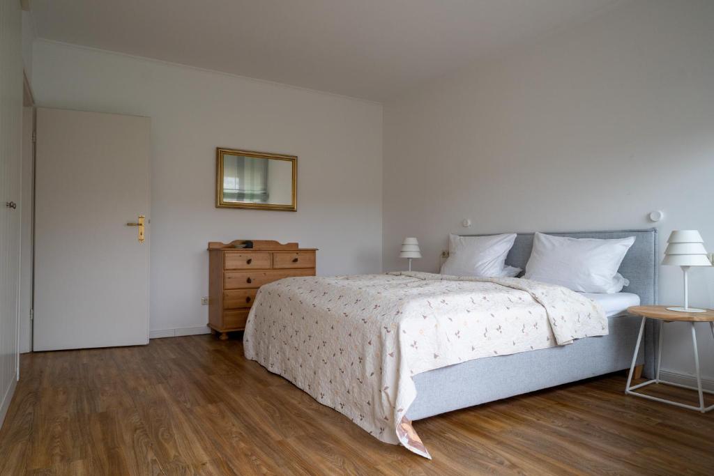 Postel nebo postele na pokoji v ubytování Hus an de Marsch