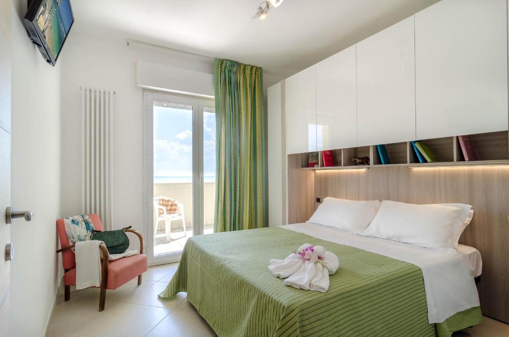 Ένα ή περισσότερα κρεβάτια σε δωμάτιο στο Residence Costa