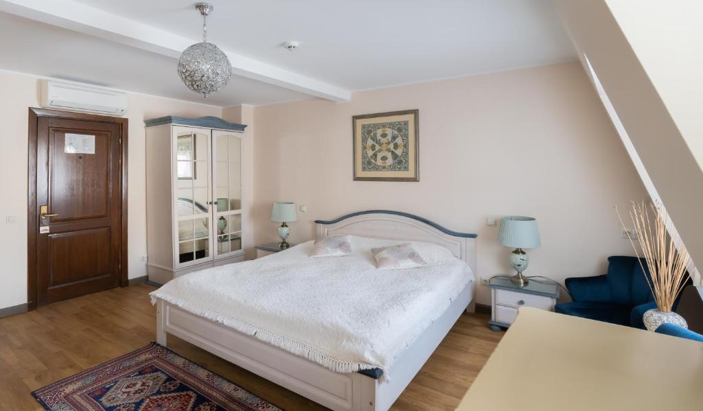 Postel nebo postele na pokoji v ubytování St. Peter's Boutique Hotel